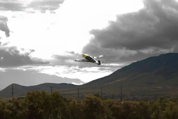 ME 109 takes off into the clouds.