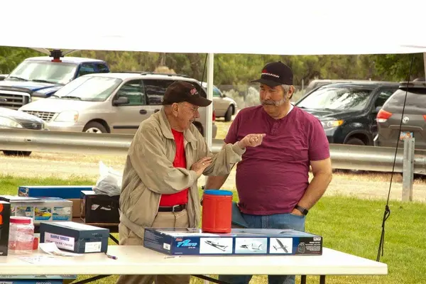 Frank and Lance take care of the raffle table.