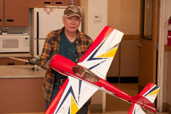 This month's drawing winner Russ Ross with his "signature edition" Yak-55. Nice plane! — with Russ Ross.